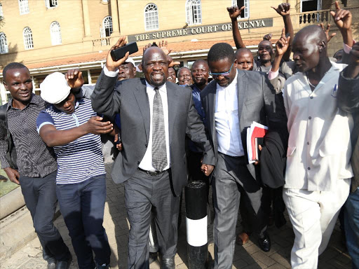 Muhoroni MP Onyango K'oyoo is cheered by his supporters outside the supreme court after the court of appeal declared him the duly nominated ODM candidate for the Muhuroni seat after an appeal over the nomination results on June 10,2017. /HEZRON NJOROGE