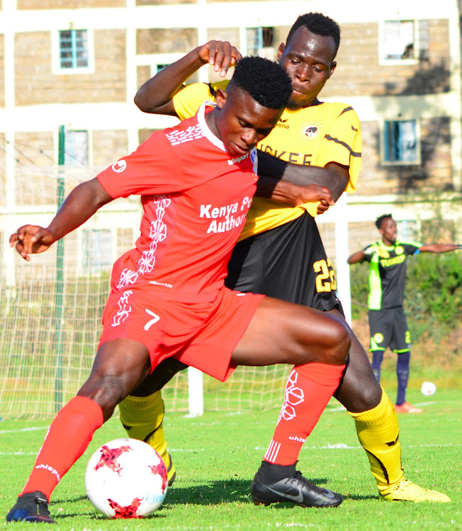 Bandari's Shaban Kenga shields the ball from Kevin Monyi of Tusker during their Premier League clash at Utalii Sports Club