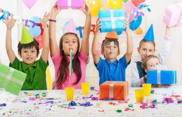 Birthday celebration A group of children at a birthday party kids party stock pictures, royalty-free photos & images