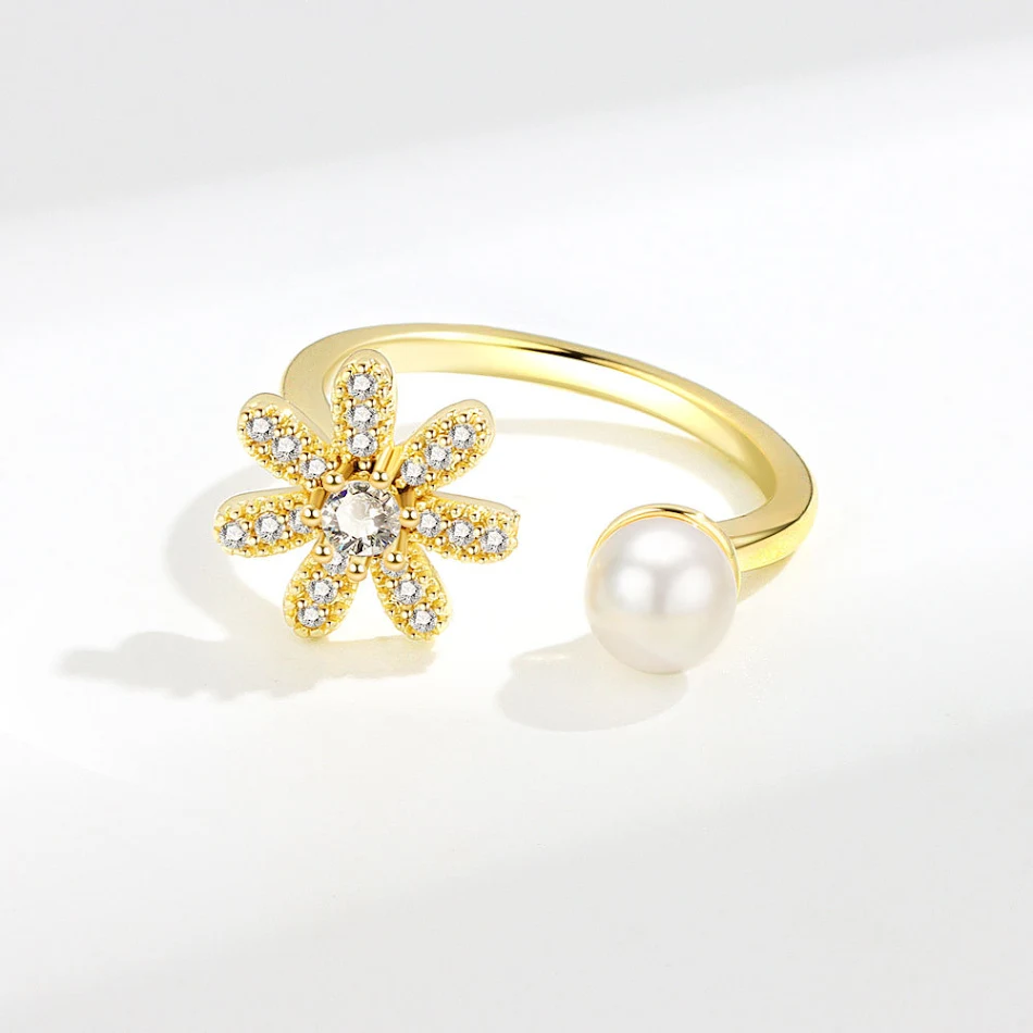 Damesring met micro-ingezette zirkonen, parel en bloem. Een elegante en schitterende ring voor een speciale gelegenheid.