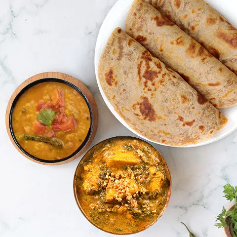 Lasooni Methi Chicken, Yellow Dal Tadka, Paratha Thali