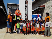 National Book Week mascot, Funda Bala, with budding bibliophiles in Mpumalanga in 2018.