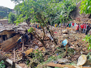 Rescuers search for bodies and survivors after a dam collapsed causing flooding, destroying homes and killing dozens in Yaounde, Cameroon on October 9 2023.