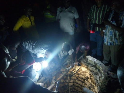 Residents attempt to rescue people trapped inside a septic tank in Mishomoroni area, Mombasa. The victims were attending a wedding ceremony at the time of the tragedy, March 10, 2018. /ERNEST CORNEL