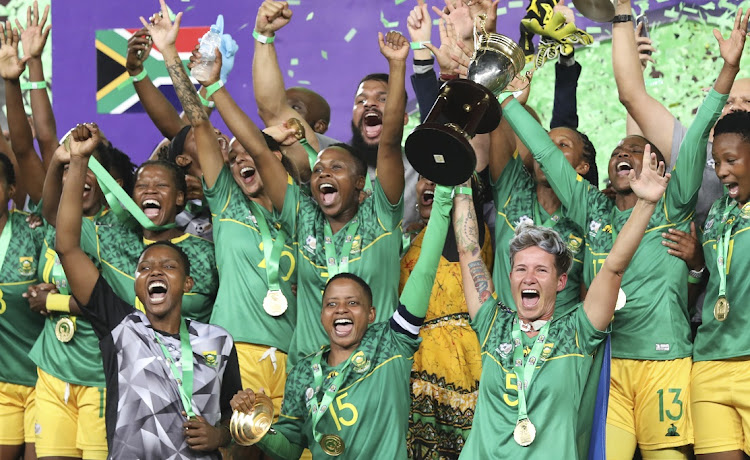 Banyana Banyana captain Refiloe Jane (centre front) and vice captains Andile Dlamini (front left) and Janine van Wyk (front right) lift the 2022 Women's Africa Cup of Nations trophy after SA's final win against Morocco at Stade Prince Moulay Abdellah in Rabat, Morocco on July 23 2022.