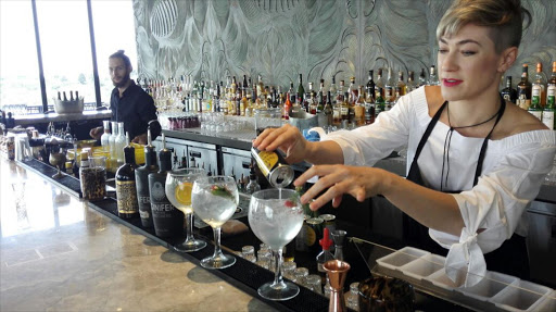 Gin maker Jaqueline Grobler serves her gin at a local restaurant.