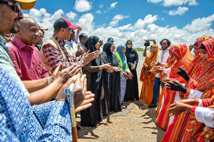 Interior CS Kithure Kindiki joins other leaders in a traditional dance during the tree planting exercise at the Garisss university.