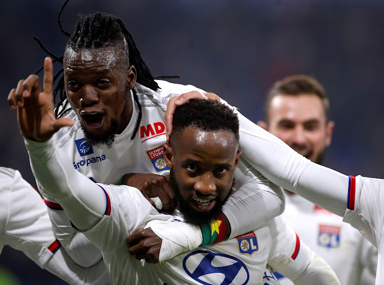 Olympique Lyonnais' Moussa Dembele celebrates scoring their second goal with Bertrand Traore