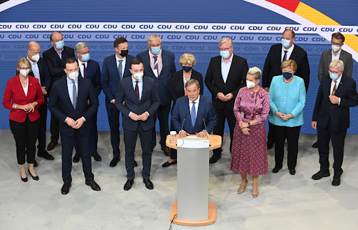 Christian Democratic Union (CDU) leader and top candidate for chancellor Armin Laschet, Susanne Laschet, Chancellor Angela Merkel and secretary general Paul Ziemiak after first exit polls for the general elections in Berlin, Germany, September 26, 2021.