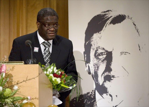 A file photo taken on January 30, 2009 shows Doctor Denis Mukwege receiving the Olof Palme Prize 2008, during a ceremony at the Swedish Parliament in Stockholm. An award-winning gynaecologist, Denis Mukwege, renowned for his work for women who have suffered sexual violence, narrowly escaped a murder bid in the Democratic Republic of Congo, a medical source said.