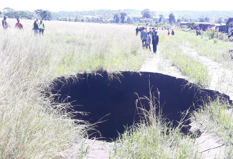 A sink hole caused by flassh floods in open field in Nakuru Town West, May 9, 2024.