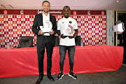 Pirates coach Josef Zinnbauer and his top striker Gabadinho Mhango pose with their Coach and Player of the Month awards,  for January. 