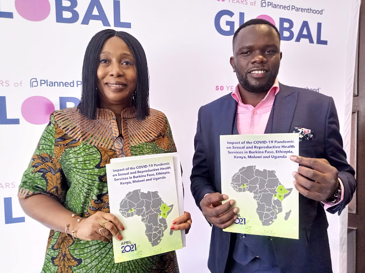 Africa Regional director PPG Achieng Akumu and Kenneth Juma, a researcher at the African Population and Health Research Centre, during the release of the study findings on May 20, 2022