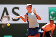 Iga Swiatek of Poland plays a forehand against Daria Kasatinka in their French Open semifinal at Roland Garros in Paris on June 2 2022.