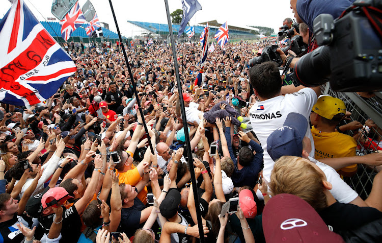 Mercedes driver Lewis Hamilton celebrates winning the 2019 British Grand Prix at Silverstone.