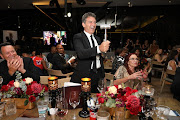 Antonio Banderas brandishes the silver gavel gifted to him by South African auctioneer Joff van Reenen after a charity auction hosted by Banderas this week raised some R1.2 million for Nkosi’s Haven that supports mothers and children affected by HIV/Aids.