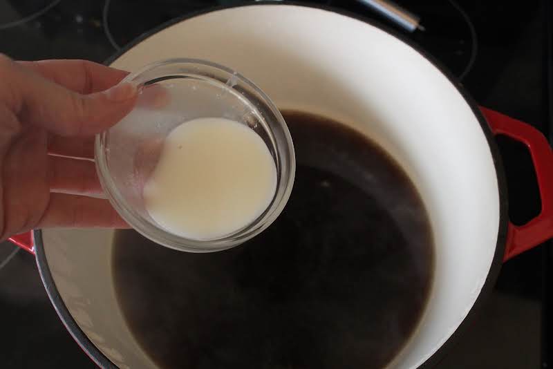 Corn Starch Slurry Added To The Saucepan.