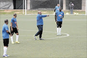 GETTING POINT ACROSS: Bafana coach Shakes Mashaba speaks with his players at training in  Soweto yesterday, before leaving for Nigeria. Photo: Veli Nhlapo