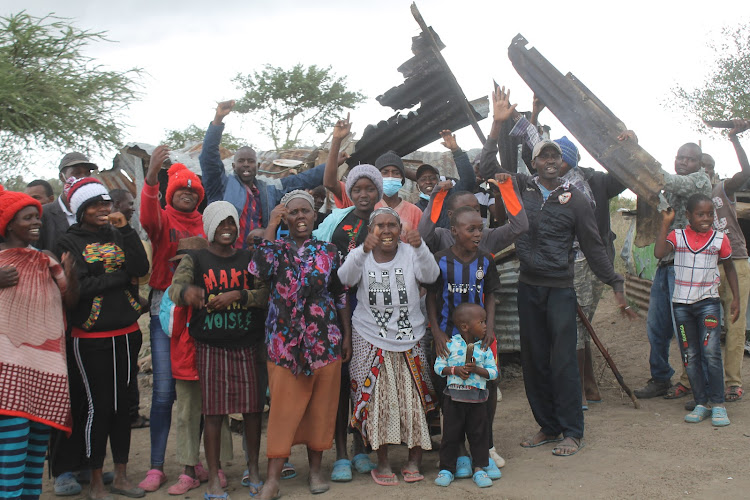 A granny with her children and grandchildren demonstrate against attempted eviction from their home on a disputed land in Ngelani, Machakos County on Wednesday, May 5.