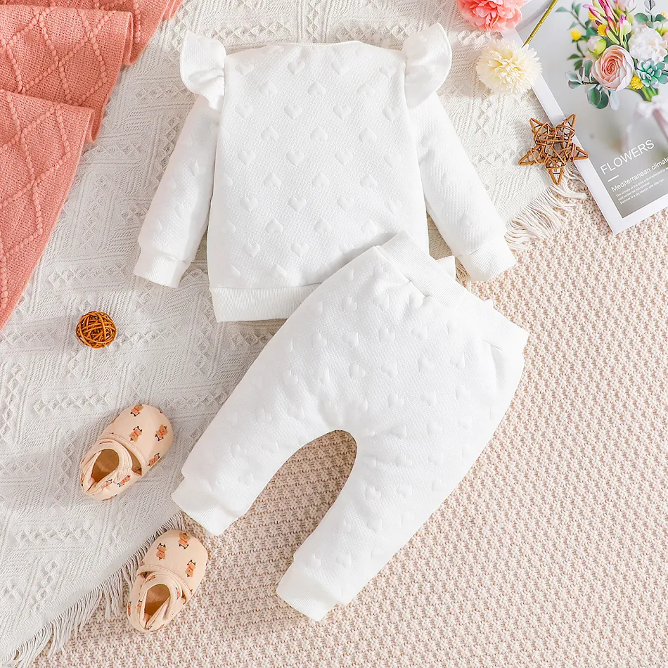 Feifei baby meisjes tweedelige set met lange mouwen top met strik en broek. Comfortabel en stijlvol voor je kleine meid.