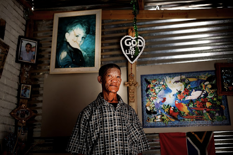 Simon Sauls poses for a portrait in Upington, South Africa. He is purportedly one of four remaining speakers of the N|uu San language.