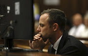 Oscar Pistorius at the Pretoria High Court on March 5, 2014, in Pretoria, South Africa. Oscar Pistorius, stands accused of the murder of his girlfriend, Reeva Steenkamp, on February 14, 2014. This is Pistorius' official trial, the result of which will determine the paralympian athlete's fate. (Photo by Alon Skuy/The Times/Gallo Images - Pool/Getty Images)