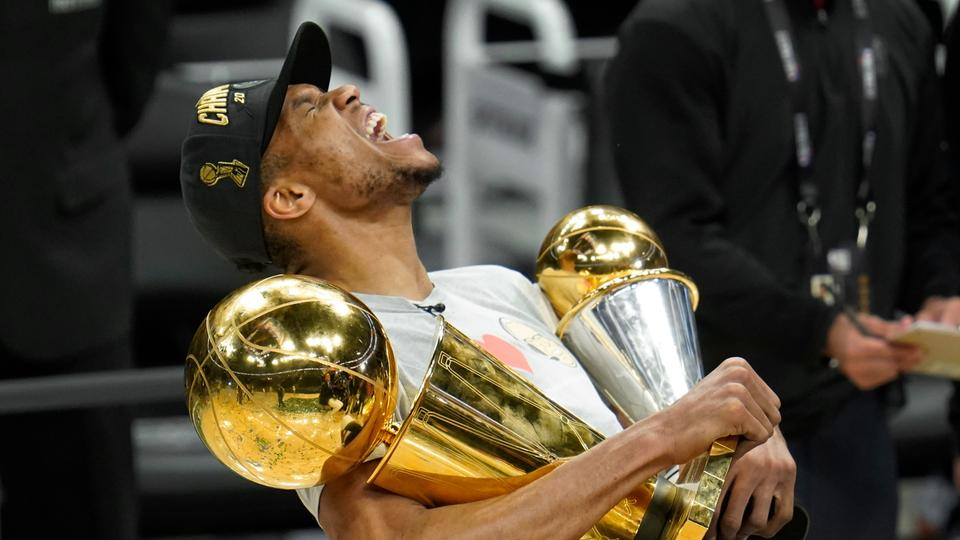 Giannis with NBA Finals Trophy and Finals MVP