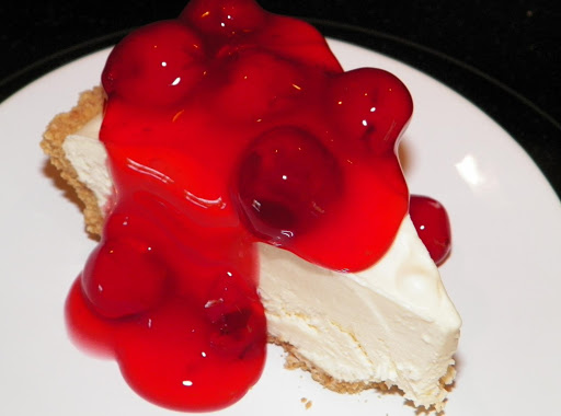 This is a small piece of frozen cheescake topped with Comstock cerry pie filling. I keep the cheesecake frozen, and serve it a piece or two at a time. It stays fresh in the freezer for over a month. 