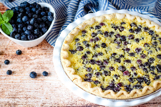 Pineapple Blueberry Chess Pie ready to be sliced.