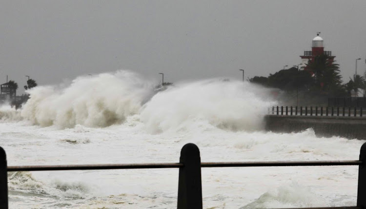 Waves batter the coastline near Mouille Point in Cape Town on Thursday as the first of three cold fronts to lash SA at the weekend made landfall.