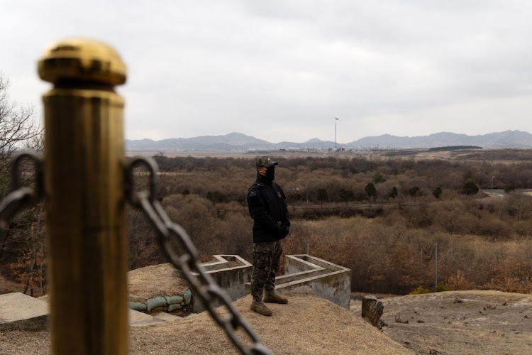 South Korean and UN Command (UNC) soldiers stand guard at the truce village of Panmunjom in the Demilitarized Zone (DMZ) in Paju, South Korea, on March 3 2023. The US and South Korea plan to hold large-scale military drills in a move set to anger Pyongyang, which has promised an unprecedented response and threatened to turn the Pacific Ocean into its 'firing range'.