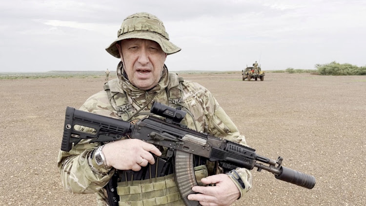 Yevgeny Prigozhin, chief of Russian private mercenary group Wagner, gives a video address in camouflage in a desert area, possibly in Africa, and published August 21 2023. Picture: PMC WAGNER/TELEGRAM/REUTERS