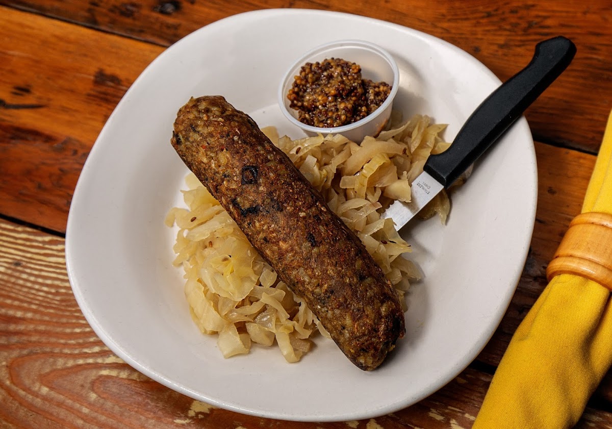 Vegan/GF brown rice, black bean, tofu, curried vegetable sausage served with either Kraut or red cabbage.