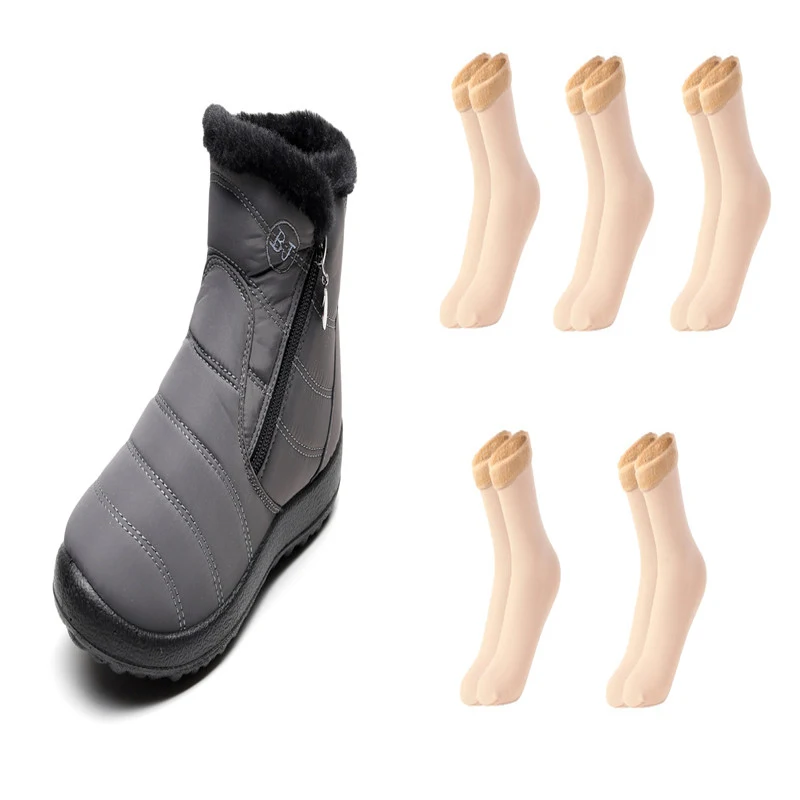 Bottes de neige imperméables grande taille à fermeture éclair latérale et mollet élargi, pour affronter l'hiver au chaud et au sec.