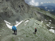 The adventurers descend  from the Col de Traversette.  