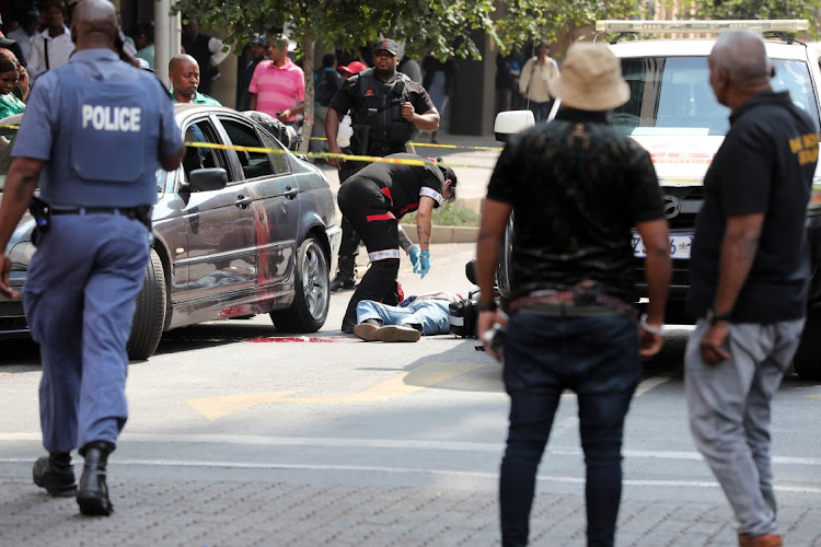 The streets of Braamfontein were a hive of activity on Thursday afternoon after a shooting which left three people dead.