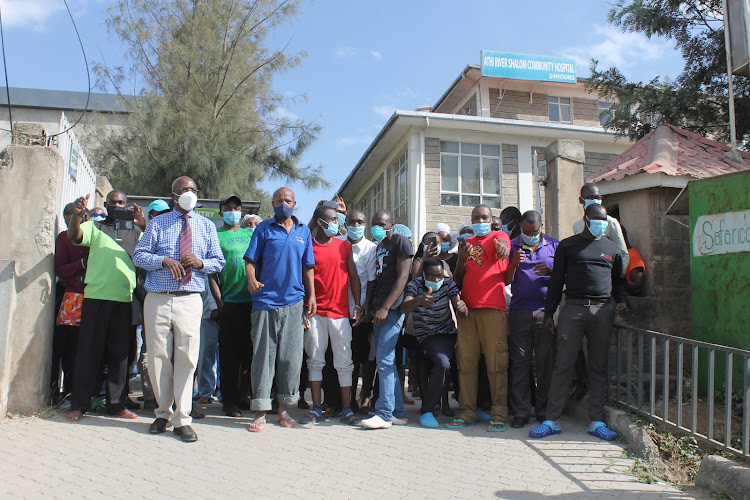 Shalom Community Hospital director Fredrick Onyango with jubilant staffers at the hospital in Athi River on Tuesday, June 30, 2020