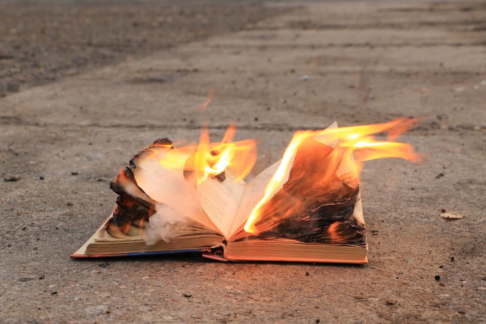 Burning books is not protest, it’s an infantile effort to kill the truth