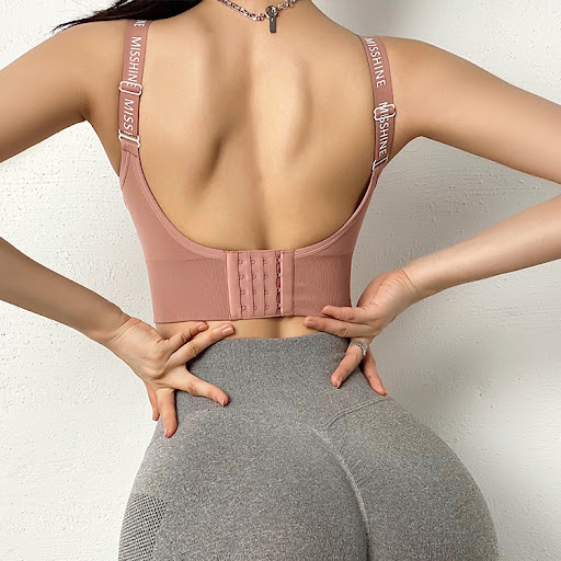 Title 7, Adjustable button-up sports bra for superior su...