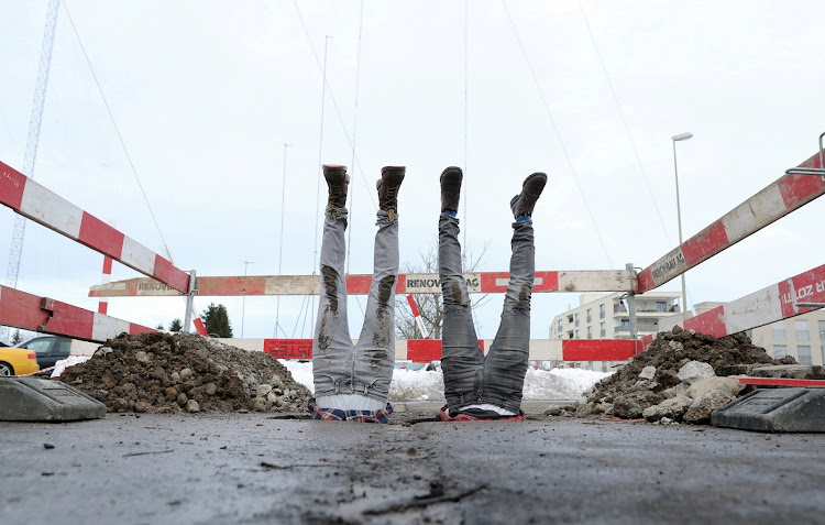 Swiss artists Frank and twin brother Patrik Riklin perform during the presentation of their ‘Fondation Riklin’ project in Regensdorf, Switzerland.