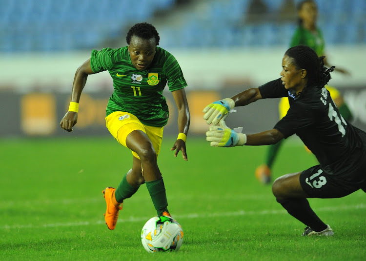 Thembi Kgatlana of South Africa dribbles past Lucrecia Bobaila of Equatorial Guinea during the 2018 TOTAL African Womens Cup of Nations match between Equatorial Guinbea and South Africa on the 21 November 2018 at Cape Coast Stadium, Ghana.