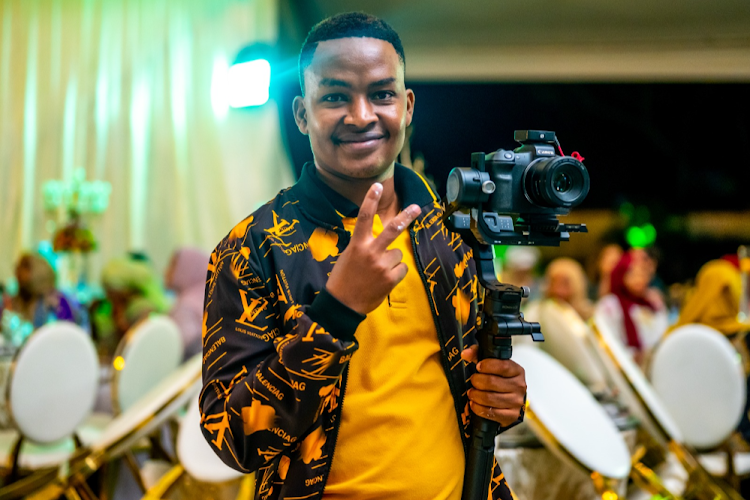 Professional videographer and photographer, Kevin Mbeva covering a corporate event.