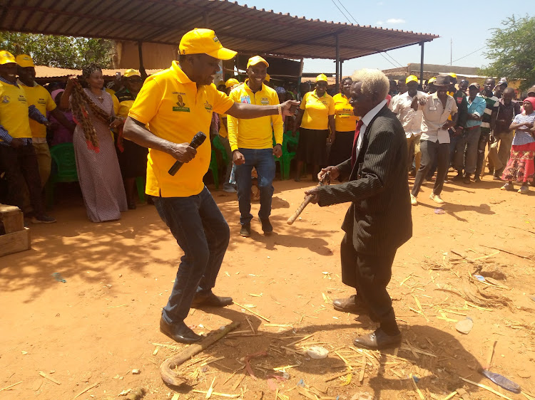 Former Embu senator Lenny Kivuti sharing a light moment with residents of Makima ward at Kiangeni on Thursday, May 12.