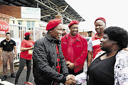 HELPING HAND: EFF leader Julius Malema with Bonginkosi Khanyile's mother, Phumzile Khathini, at Westville prison. With them are EFF chairman Dali Mpofu and secretary-general, Godrich Gardee