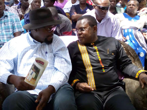 Senate Speaker Kenneth Lusaka and Kanduyi MP Wafula Wamuyinyi during a funeral in Buema. /JOHN NALIANYA