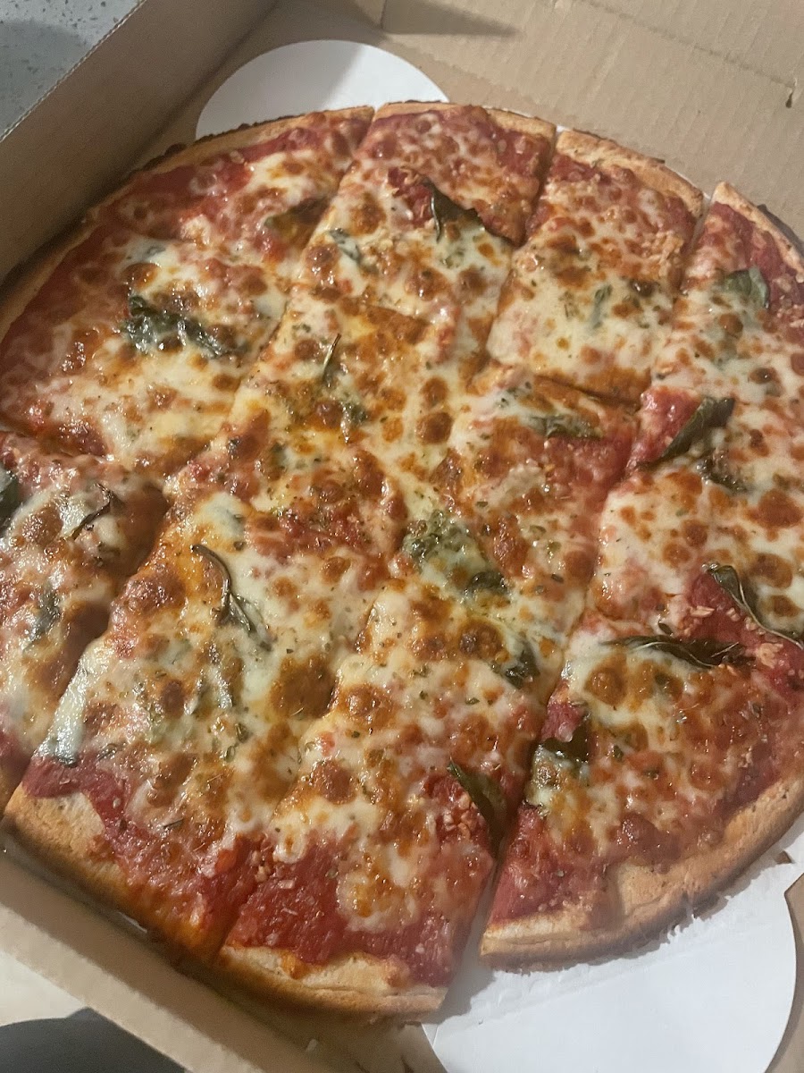 Cheese pizza with basil