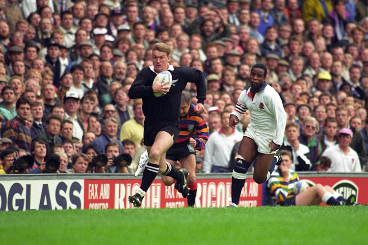 New Zealand's John Kirwan is chased by England's Chris Oti