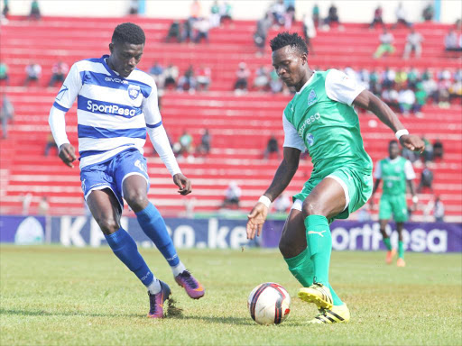 AFC leopards Kamura Robinson tussle the ball with Gor Mahia George Odhiambo.JPG