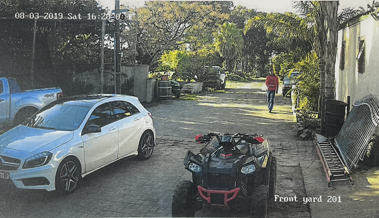 This image hows a man reportedly fitting Jeremy Sias' description walking alongside the main farmhouse on August 3 2019.