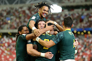 Blitzboks players celebrate after winning a match. 